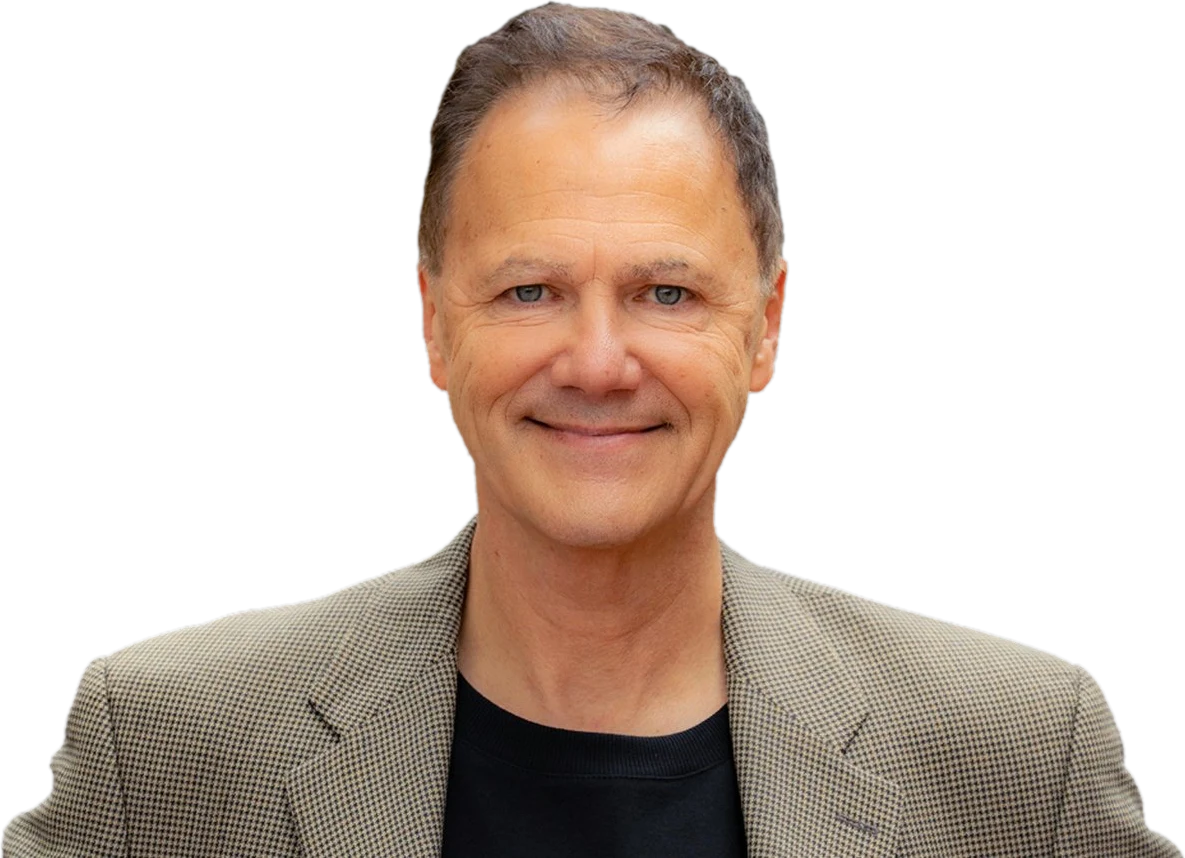 Chuck Garcia, smiling portrait in a tan houndstooth jacket, EQ keynote speaker and Columbia University professor.