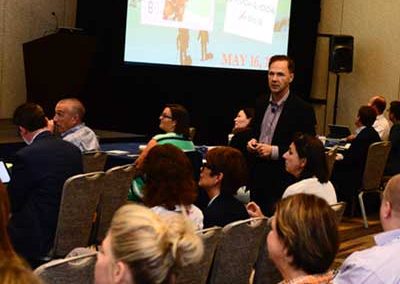 chuck speaking at conference